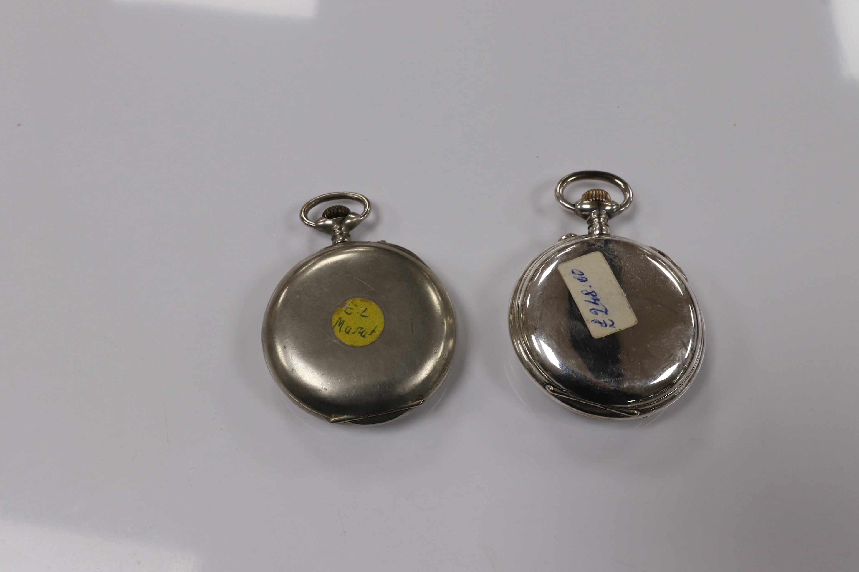 Two nickel or chrome cased pocket watches, Hebdomas, case diameter 50mm and calendar, case diameter 50mm. Condition - fair